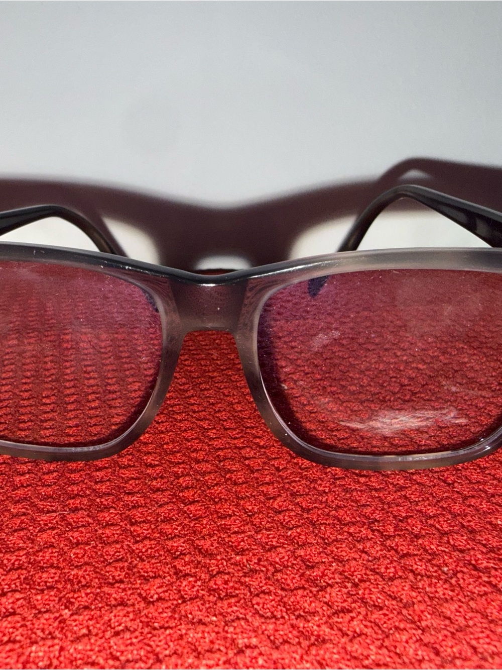 Alexander McQueen Black Frame Sunglasses with Red Lenses